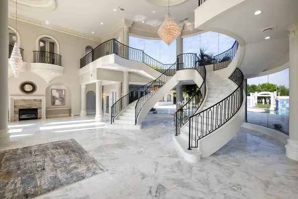 Professional interior entry photography demonstrating expert use of studio lighting to capture architectural details