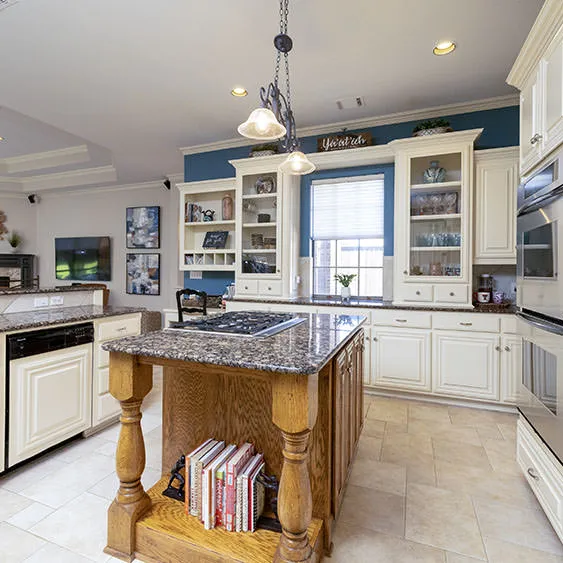 Modern kitchen interior with blue accents and professional lighting